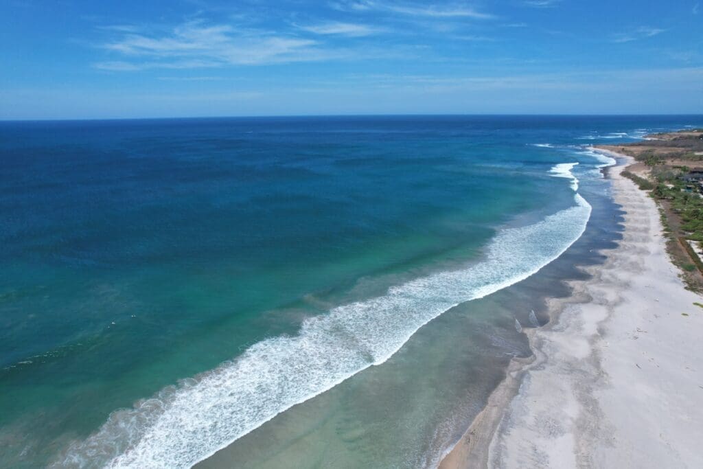 Costa Rican beachfront gives way to expansive waters shading from turquoise to deep blue that are perfect for surfing