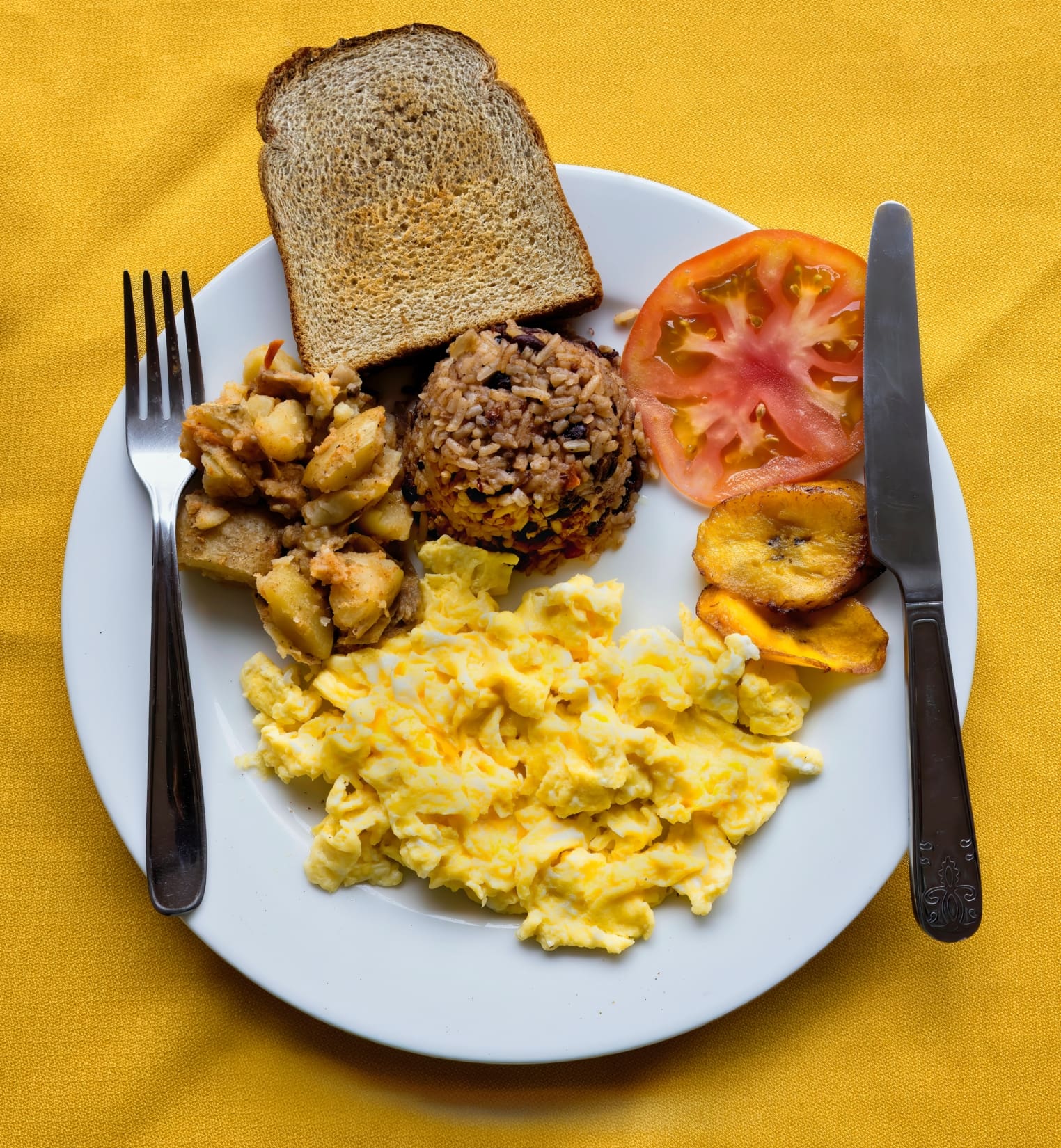 Traditional Costa Rican Breakfast served with Gallo Pinto and Plantains https://unsplash.com/photos/o62OvBllTME