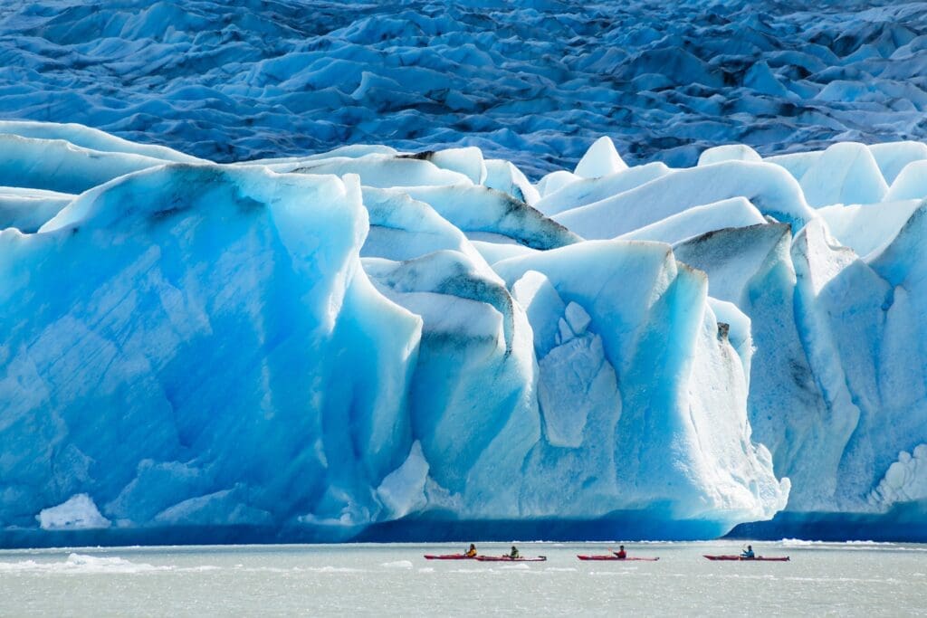 Kayakers in front of Grey Glacier on Grey Lake (Lago Grey) in Torres del Paine National Park, Chile